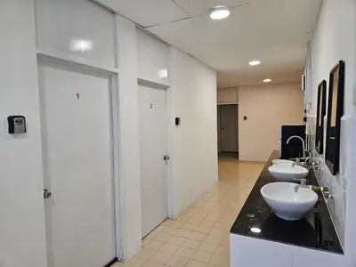a bathroom with two sinks and two toilets in it at SS TWO Hostel Penang in George Town