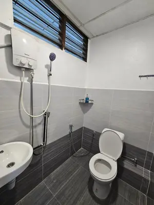 a bathroom with a toilet and a sink at SS TWO Hostel Penang in George Town