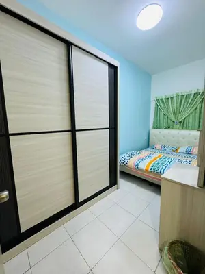 a bedroom with sliding glass doors and a bed at AYAAN DELUXE HOMESTAY FREE WiFi in Cameron Highlands