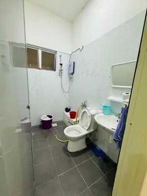 a bathroom with a shower and a toilet and a sink at AYAAN DELUXE HOMESTAY FREE WiFi in Cameron Highlands