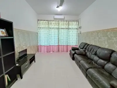 a living room with a couch and a television at Homestay NAQ D' Kuala Kangsar in Kuala Kangsar