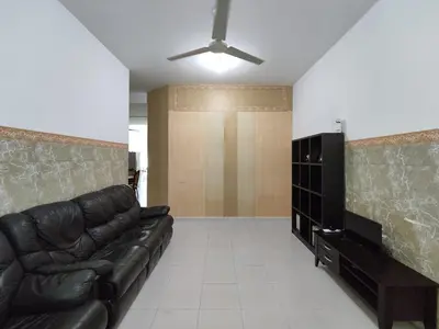 a living room with a leather couch and a television at Homestay NAQ D' Kuala Kangsar in Kuala Kangsar