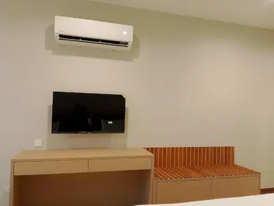 a room with a flat screen tv on a wall at Forum Hotel Penang in George Town