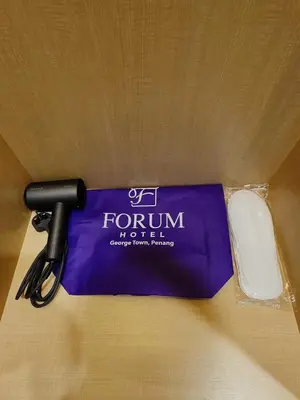 a computer mouse and a mouse pad on a table at Forum Hotel Penang in George Town