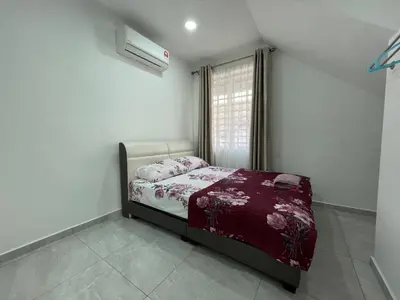 a bedroom with a bed and a window at Penang Studio Homestay at Kelawai Rd, Georgetown by SK Vacation Homes in George Town