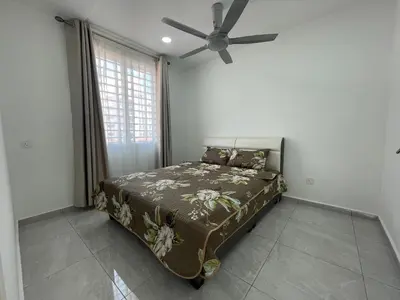 a bedroom with a bed and a ceiling fan at Penang Studio Homestay at Kelawai Rd, Georgetown by SK Vacation Homes in George Town