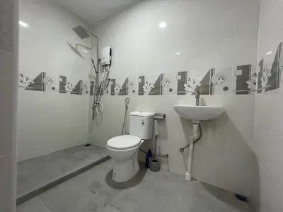 a bathroom with a toilet and a sink at Penang Studio Homestay at Kelawai Rd, Georgetown by SK Vacation Homes in George Town