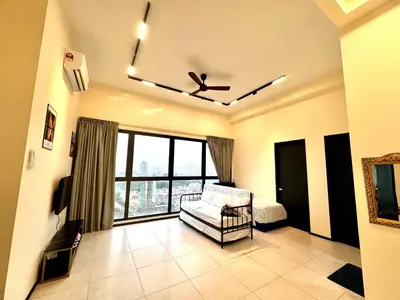 a living room with a couch and a large window at Family House In Georgetown a27 in Jelutong