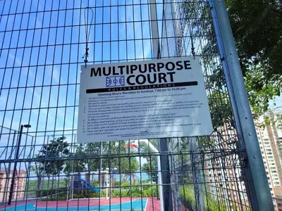 a sign on a fence that reads multipurchase eye court at Family House In Georgetown a27 in Jelutong