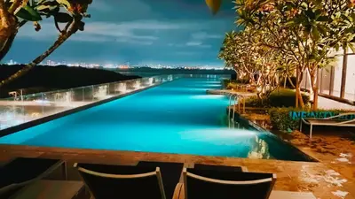 a view of a river from a resort at night at Family House In Georgetown a27 in Jelutong