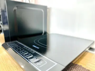 a laptop computer sitting on top of a table at world premium apartment 3BR pool sea view netflix 14pax a27 in Jelutong