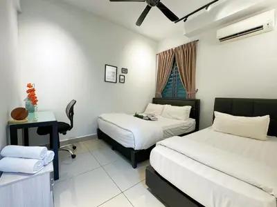 a hotel room with two beds and a desk and a window at Ipoh The Majestic Imperial Tower Ipoh Town Centre, 3BR Fully Air Con Homestay in Ipoh