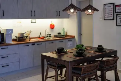 a kitchen with a wooden table with chairs and a counter at Horizon Ipoh 8Pax 3R2B - Tropical Bali Retreat in Ipoh