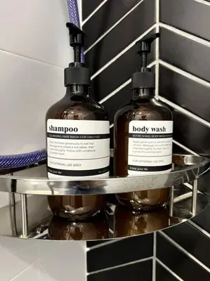 two bottles of alcohol are sitting on a shelf at Horizon Ipoh 8Pax 3R2B - Tropical Bali Retreat in Ipoh