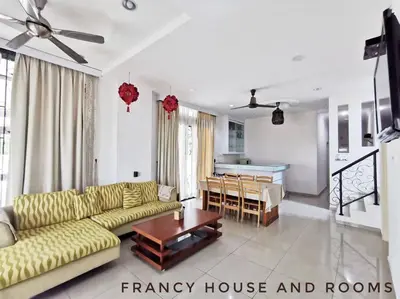 a living room with a couch and a table at Castle Bungalow In Bercham Ipoh in Kampong Tasek