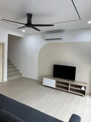 a living room with a flat screen tv on a wall at 3Story Family Suites 7pax Ikea Batu Kawan 5min in Batu Kawan