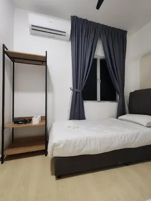 a bedroom with a large bed and a window at 3Story Family Suites 7pax Ikea Batu Kawan 5min in Batu Kawan