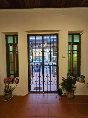 an entrance to a room with a iron gate at HOME Penang in George Town