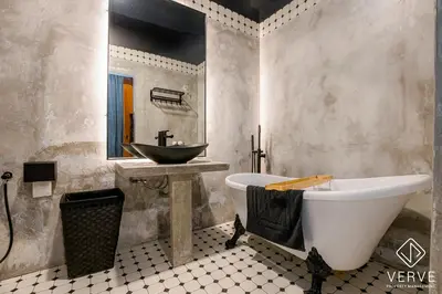 a bathroom with a bath tub and a sink at Ipoh The Label by Verve in Kampong Simee