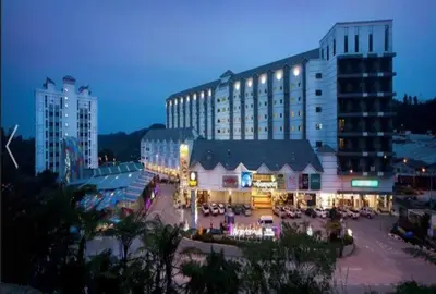 a large building with a patio in front of it at Cameron Nova Highlands Resorts in Brinchang