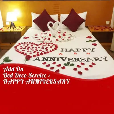 a bed with a happy anniversary sign on it at Cameron Nova Highlands Resorts III in Brinchang
