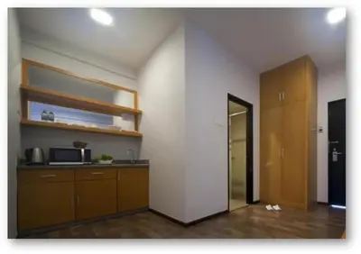 a room with a kitchen with a counter and a microwave at Cameron Nova Highlands Resorts III in Brinchang