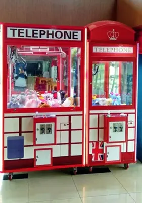 a red and white toy fire truck with people inside at Yew Boutique Hotel in Teluk Intan