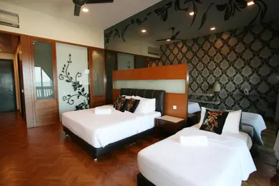 a hotel room with two beds with white sheets at Profolio @ Straits Quay in George Town