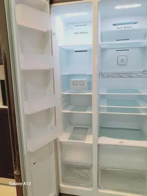 a white refrigerator with its door open with its empty shelves at Yarra SP Homestay in Sungai Petani