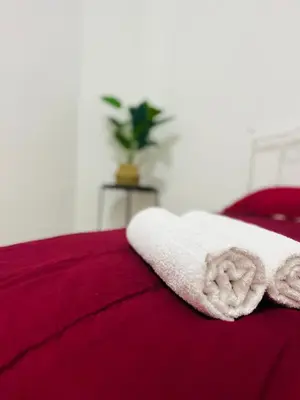 a towel laying on top of a bed at Casa Kita Homestay in Bandar Baharu