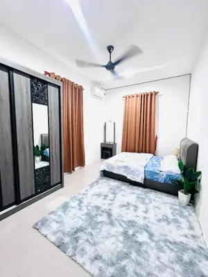 a bedroom with a bed and a large window at Casa Kita Homestay in Bandar Baharu
