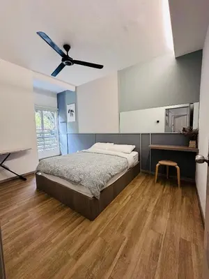 a bedroom with a bed and a ceiling fan at Adamhawa Homestay 3 Emerald Avenue Brinchang in Brinchang