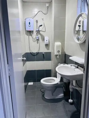 a bathroom with a shower and a toilet and a sink at Adamhawa Homestay 3 Emerald Avenue Brinchang in Brinchang