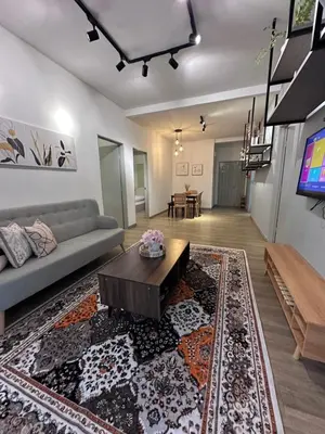 a living room with a couch and a table at Adamhawa Homestay 3 Emerald Avenue Brinchang in Brinchang