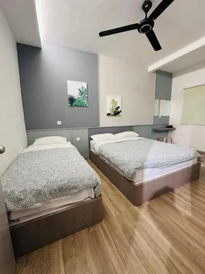 a bedroom with two beds and a ceiling fan at Adamhawa Homestay 3 Emerald Avenue Brinchang in Brinchang