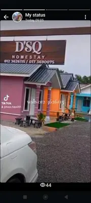 a picture of a house with a sign on it at D'SQ Homestay in Tanjung Karang