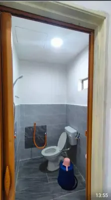 a bathroom with a toilet in a room at D'SQ Homestay in Tanjung Karang