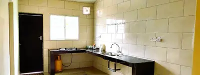 a large bathroom with a sink and a window at Cozy Homestay in Ipoh