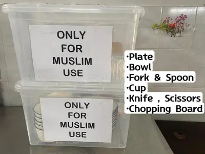 an open refrigerator with signs on the front of it at Legreene Ipoh 15pax in Tambun