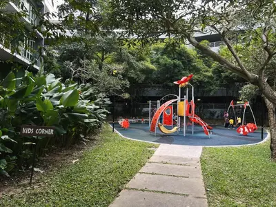 a playground in a park with a play equipment at Ipoh Lakeside Apartment with Mountain View in Kampong Batu Lapan