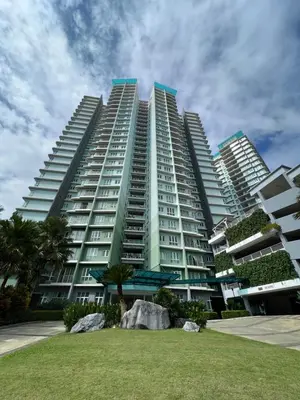 a large apartment building with a park in front of it at Ipoh Lakeside Apartment with Mountain View in Kampong Batu Lapan