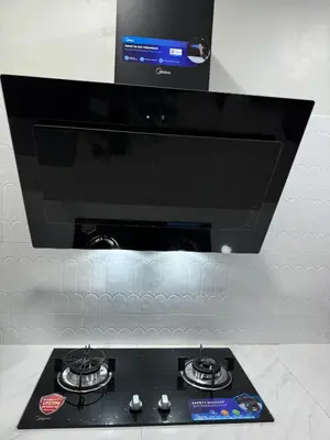 a black stove top with a tv above it at Namel Homestay Taiping in Kampong Jana