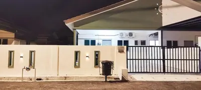 a house with a fence in front of it at Ceq Atiah Homestay in Seri Iskandar