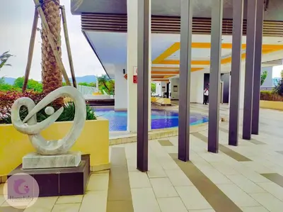 a sculpture in the middle of a building with a pool at The Majestic Condo Ipoh Home Fairy 5 in Ipoh