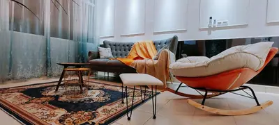 a living room with two chairs and a couch at A boutique Warm falim home in Kampong Pasir Puteh