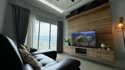 a living room with a couch and a flat screen tv at IPOH Sky Garden Residences, 31200 Chemor Ipoh in Chemor