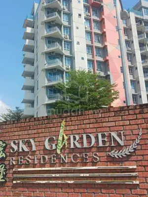 a sign on top of a brick wall with a tall building at IPOH Sky Garden Residences, 31200 Chemor Ipoh in Chemor
