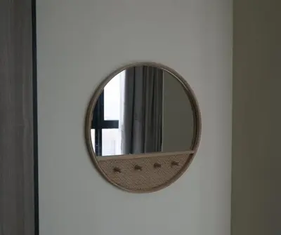a round mirror on a wall in a room at Sky High Stuning Penang Bridge & City Views 3BR in Jelutong