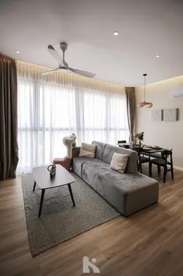 a living room with a couch and a table at Sky High Stuning Penang Bridge & City Views 3BR in Jelutong