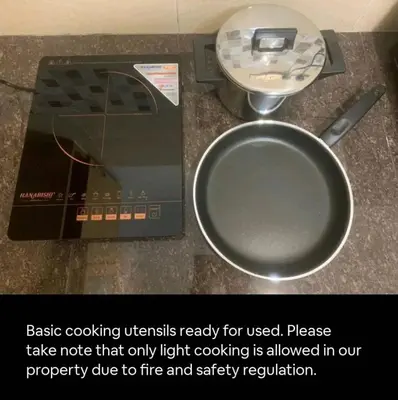 a table with a scale and a frying pan at 1Pax-2Pax Single Room in Bukit Mertajam Alma Impian in Juru